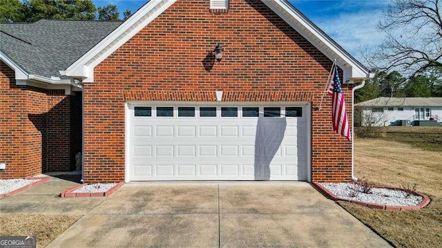 garage with concrete driveway