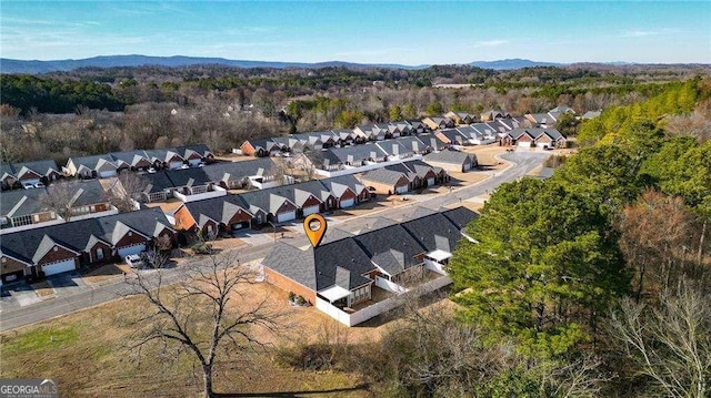 drone / aerial view with a residential view and a mountain view