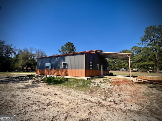 view of outbuilding featuring a carport