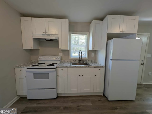 kitchen with white appliances, dark wood finished floors, under cabinet range hood, white cabinetry, and a sink