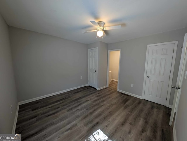 unfurnished bedroom featuring a ceiling fan, baseboards, and wood finished floors