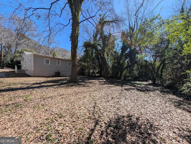 view of yard featuring central AC unit