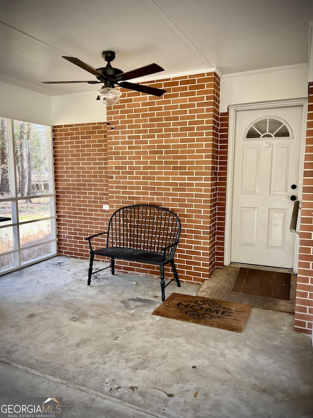 entrance to property with ceiling fan