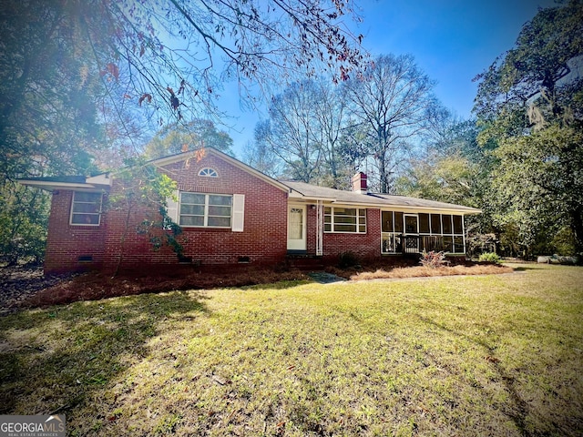 single story home featuring a chimney, brick siding, crawl space, and a front yard