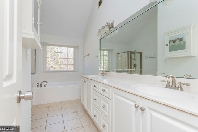 full bath with vaulted ceiling, a sink, visible vents, and tile patterned floors