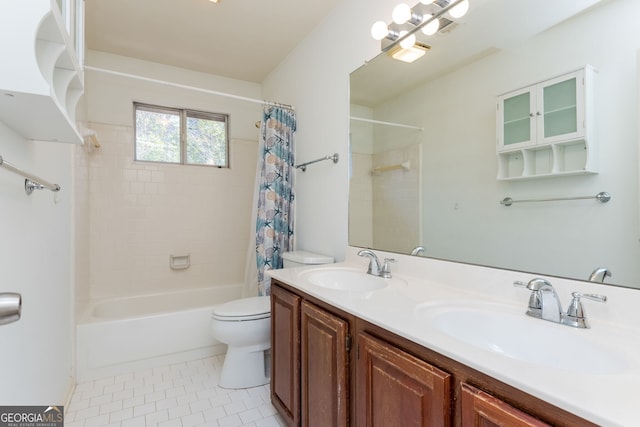 full bathroom featuring tile patterned flooring, a sink, toilet, and shower / bath combo with shower curtain