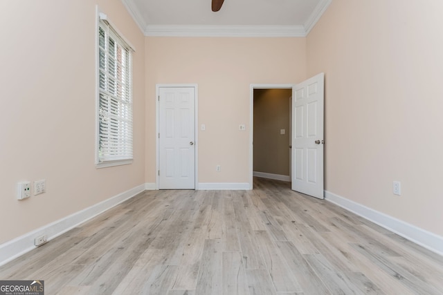 unfurnished bedroom with light wood-style floors, baseboards, and ornamental molding