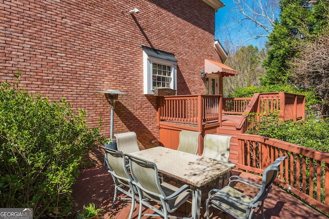 wooden deck with outdoor dining area