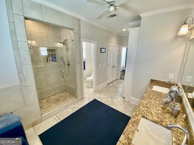 bathroom featuring crown molding, visible vents, toilet, a stall shower, and a sink