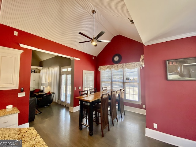 dining area featuring lofted ceiling, baseboards, visible vents, and dark wood-type flooring