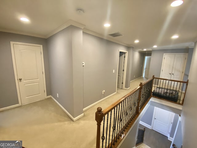 corridor with carpet floors, crown molding, recessed lighting, an upstairs landing, and baseboards