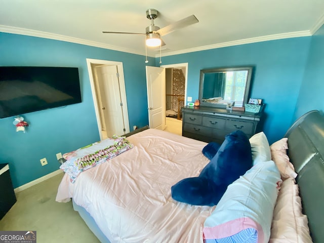 carpeted bedroom with ceiling fan, ornamental molding, and baseboards