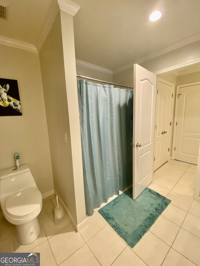 full bath with toilet, baseboards, crown molding, and tile patterned floors