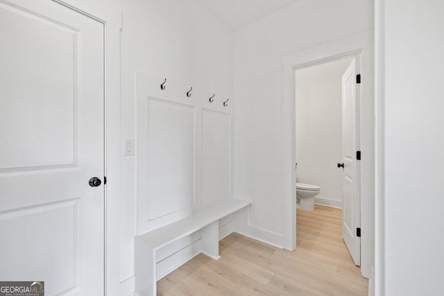 mudroom with baseboards and light wood-style floors