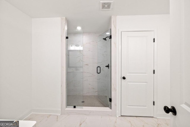 bathroom featuring marble finish floor, a marble finish shower, recessed lighting, visible vents, and baseboards