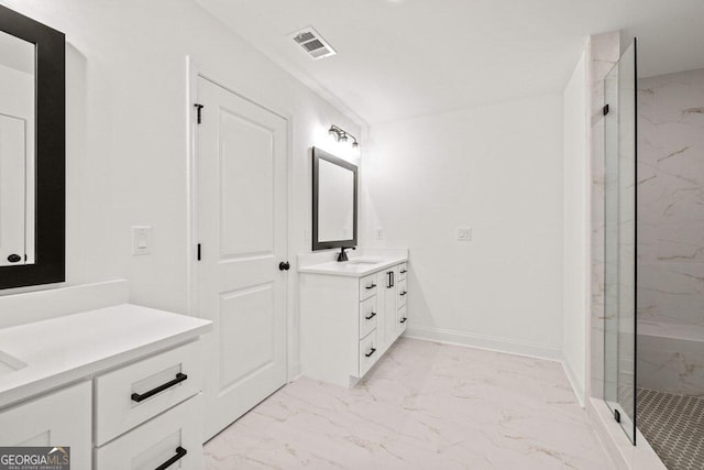 full bath featuring a marble finish shower, baseboards, visible vents, marble finish floor, and vanity