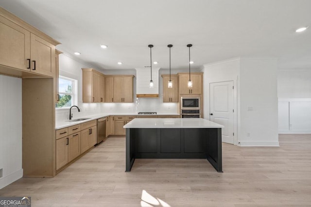 kitchen featuring a kitchen island, appliances with stainless steel finishes, light countertops, light brown cabinetry, and a sink