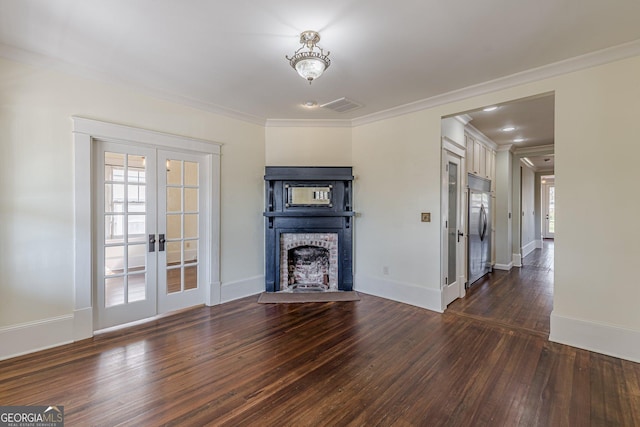 unfurnished living room with a fireplace, visible vents, french doors, dark wood-style floors, and crown molding