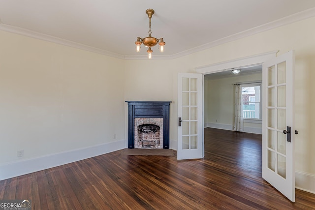 unfurnished living room with a fireplace with flush hearth, french doors, wood finished floors, and ornamental molding