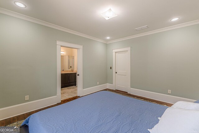 bedroom with ornamental molding, baseboards, recessed lighting, and wood finished floors