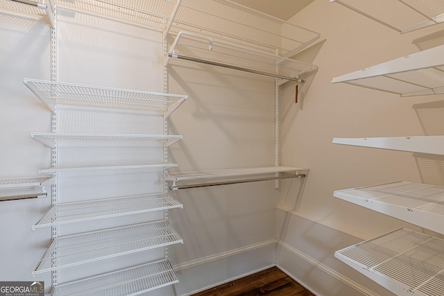 spacious closet with wood finished floors