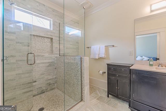 bathroom with a stall shower, baseboards, connected bathroom, crown molding, and vanity