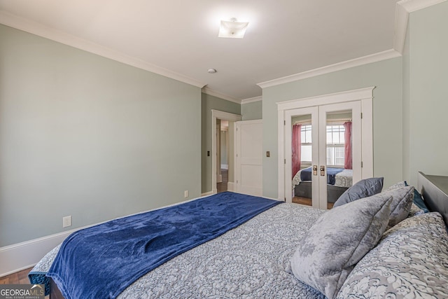 bedroom featuring crown molding, french doors, wood finished floors, and baseboards