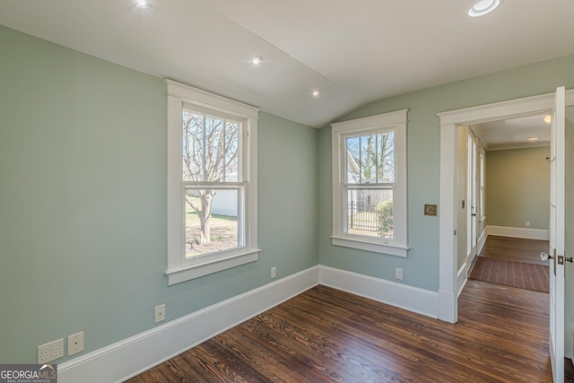 unfurnished room featuring recessed lighting, dark wood-type flooring, baseboards, and vaulted ceiling