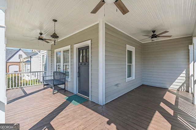 deck with a porch and a ceiling fan