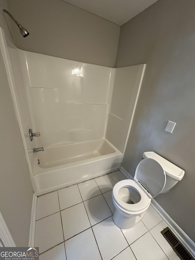 bathroom with toilet, shower / tub combination, visible vents, and tile patterned floors