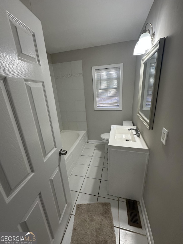 bathroom with visible vents, baseboards, toilet, tile patterned flooring, and vanity