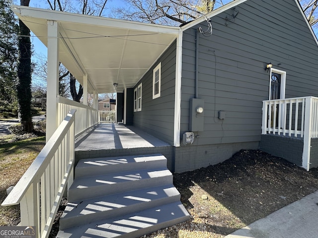 view of side of property with an attached carport