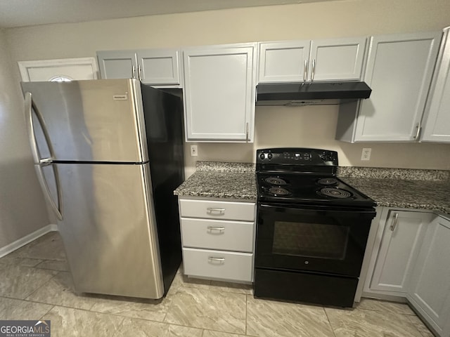 kitchen with black electric range, freestanding refrigerator, white cabinets, dark stone countertops, and under cabinet range hood