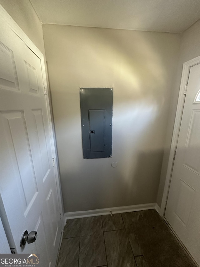 interior space with electric panel and baseboards