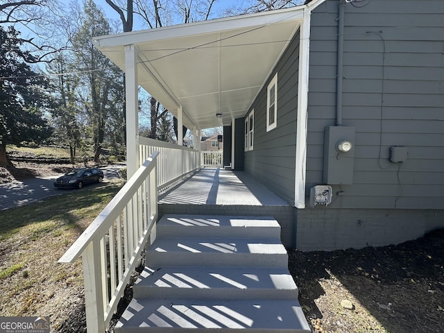 exterior space featuring a carport and a porch