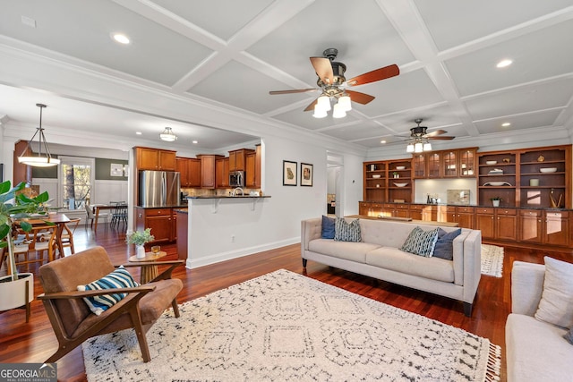 living room featuring crown molding, baseboards, coffered ceiling, and dark wood-type flooring