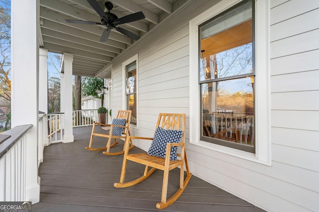 wooden deck with a ceiling fan and covered porch