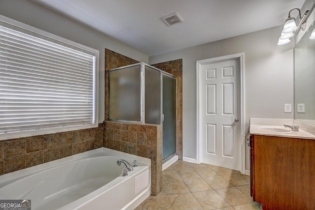 full bath with visible vents, a shower stall, vanity, tile patterned flooring, and a bath