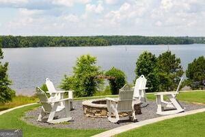 property view of water with an outdoor fire pit