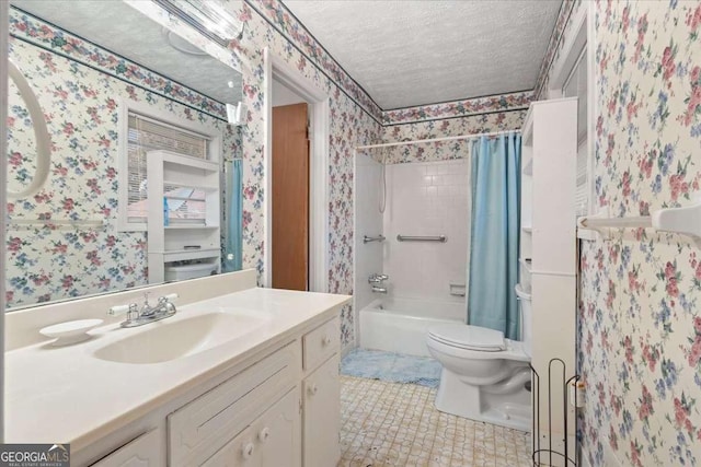 bathroom featuring toilet, wallpapered walls, a textured ceiling, and vanity