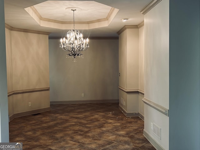 unfurnished dining area with ornamental molding, a raised ceiling, visible vents, and a notable chandelier