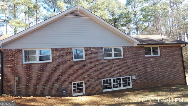 view of home's exterior with brick siding