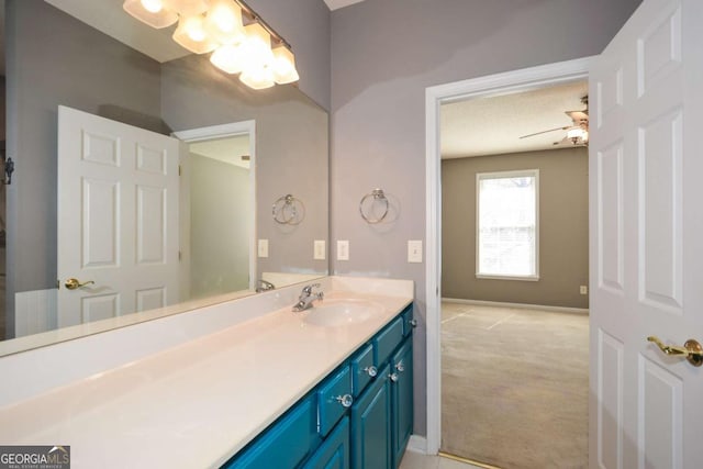 bathroom with vanity and baseboards