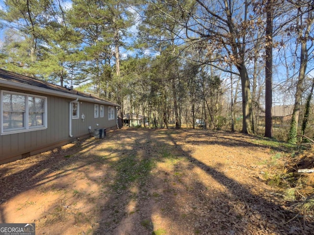 view of yard with central AC unit