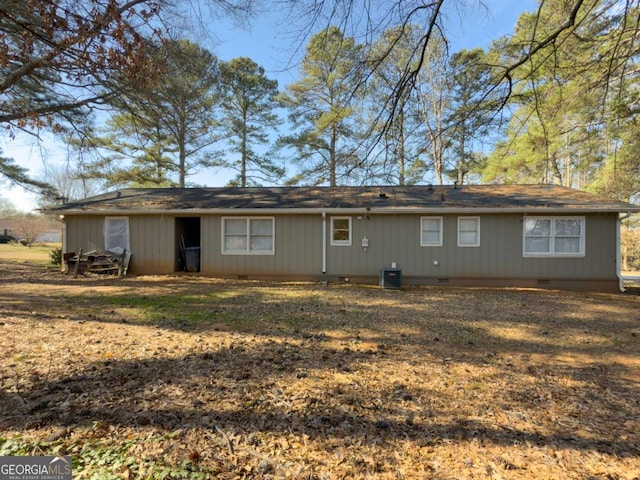 rear view of house featuring crawl space and central AC