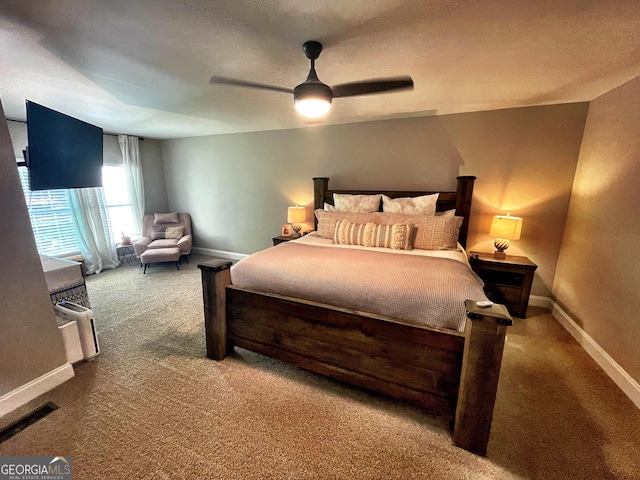 bedroom with a ceiling fan, carpet, visible vents, and baseboards