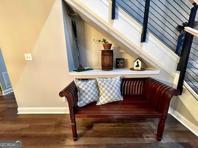 sitting room featuring wood finished floors, visible vents, and baseboards