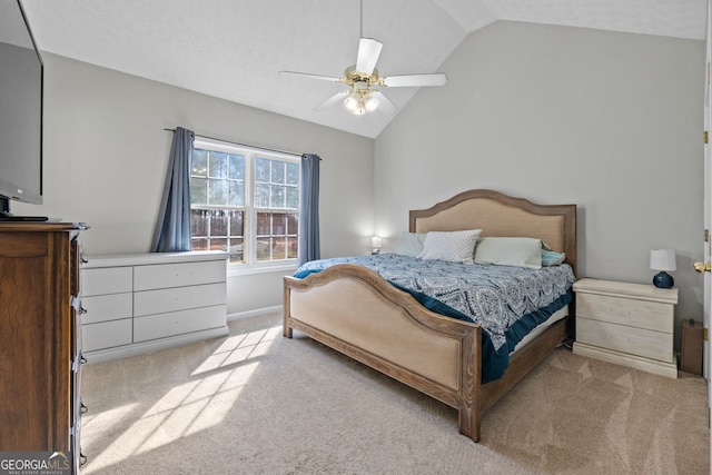 carpeted bedroom featuring vaulted ceiling, baseboards, and ceiling fan