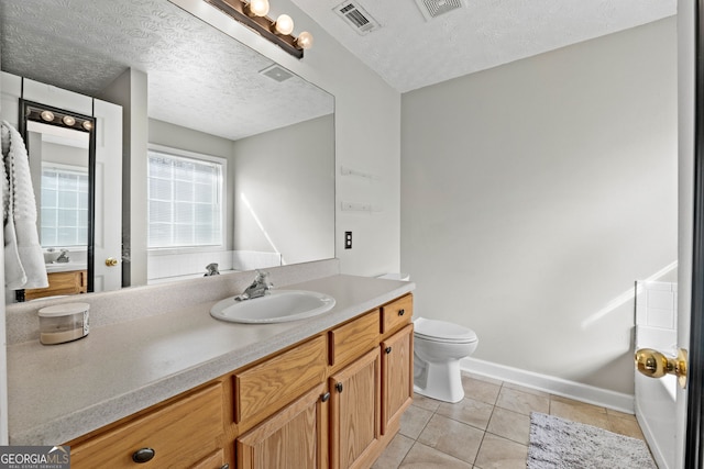 full bathroom featuring a textured ceiling, tile patterned flooring, and visible vents