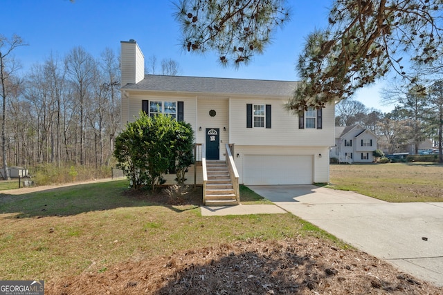 split foyer home featuring driveway, a garage, a chimney, and a front yard